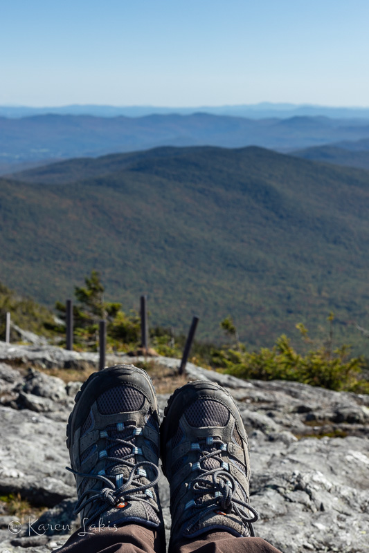 looking over my hiking boots at the top of Jay Peak