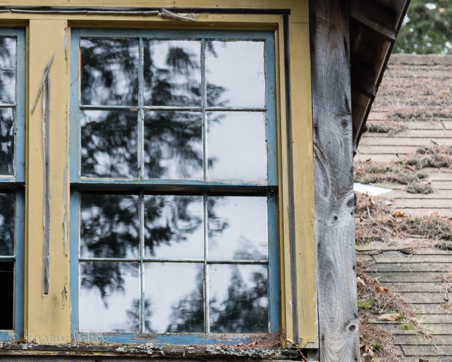 old window of abandoned cabin