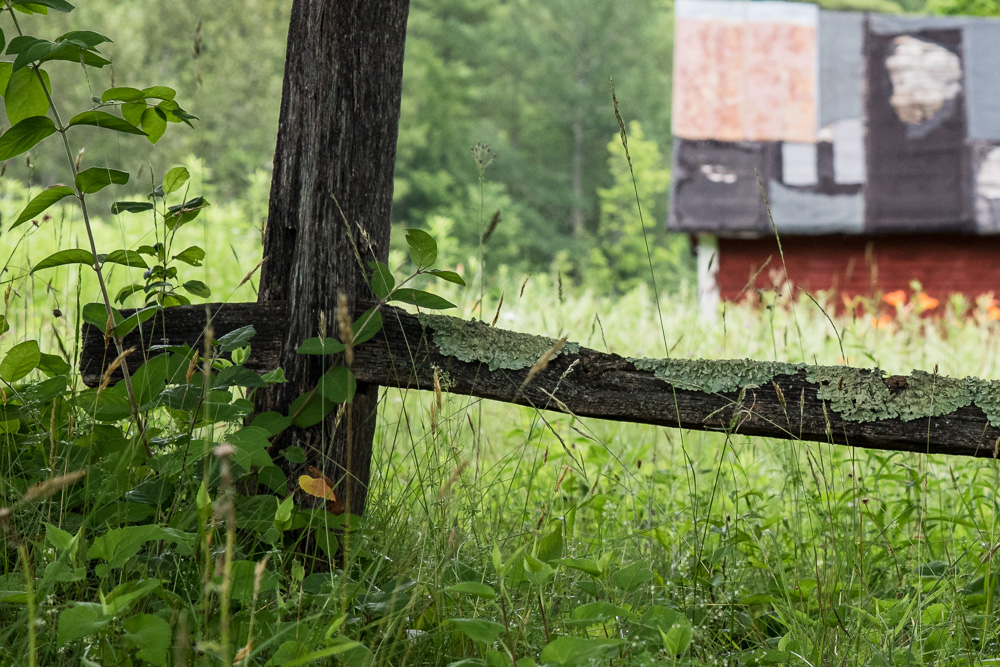 rustic fence with patchwork barn